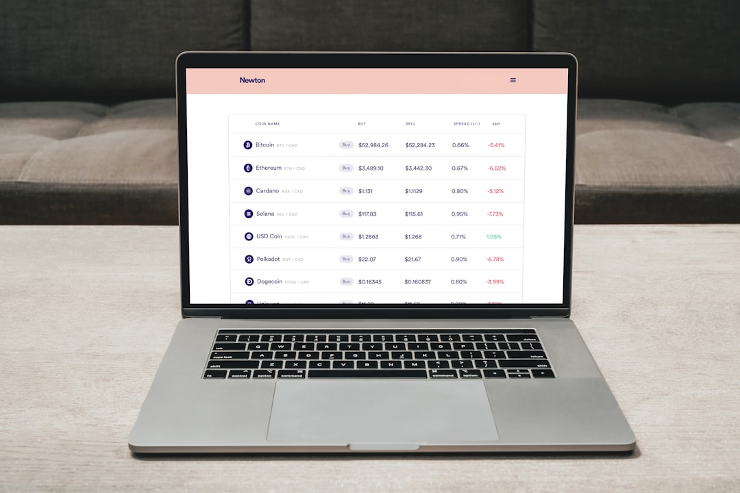 a laptop on a table, Buy crypto in Canada with Newton<p></figure>