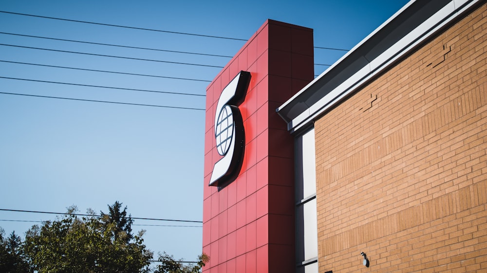 a large red sign on a building