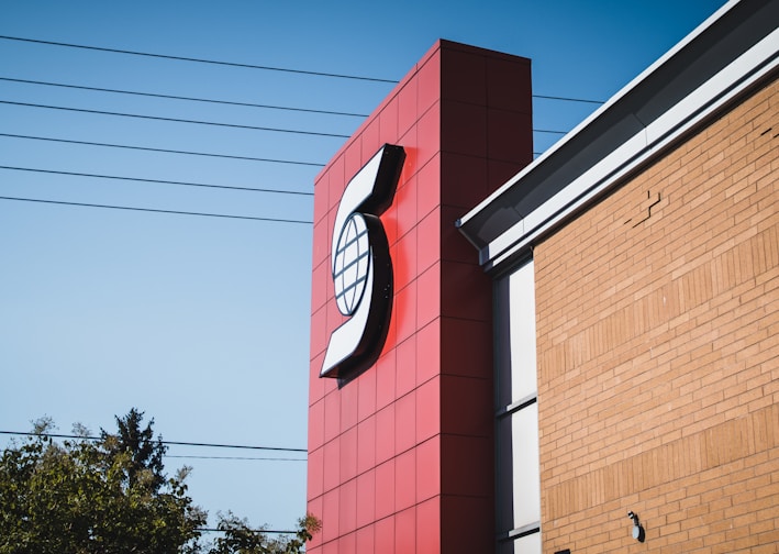 a large red sign on a building