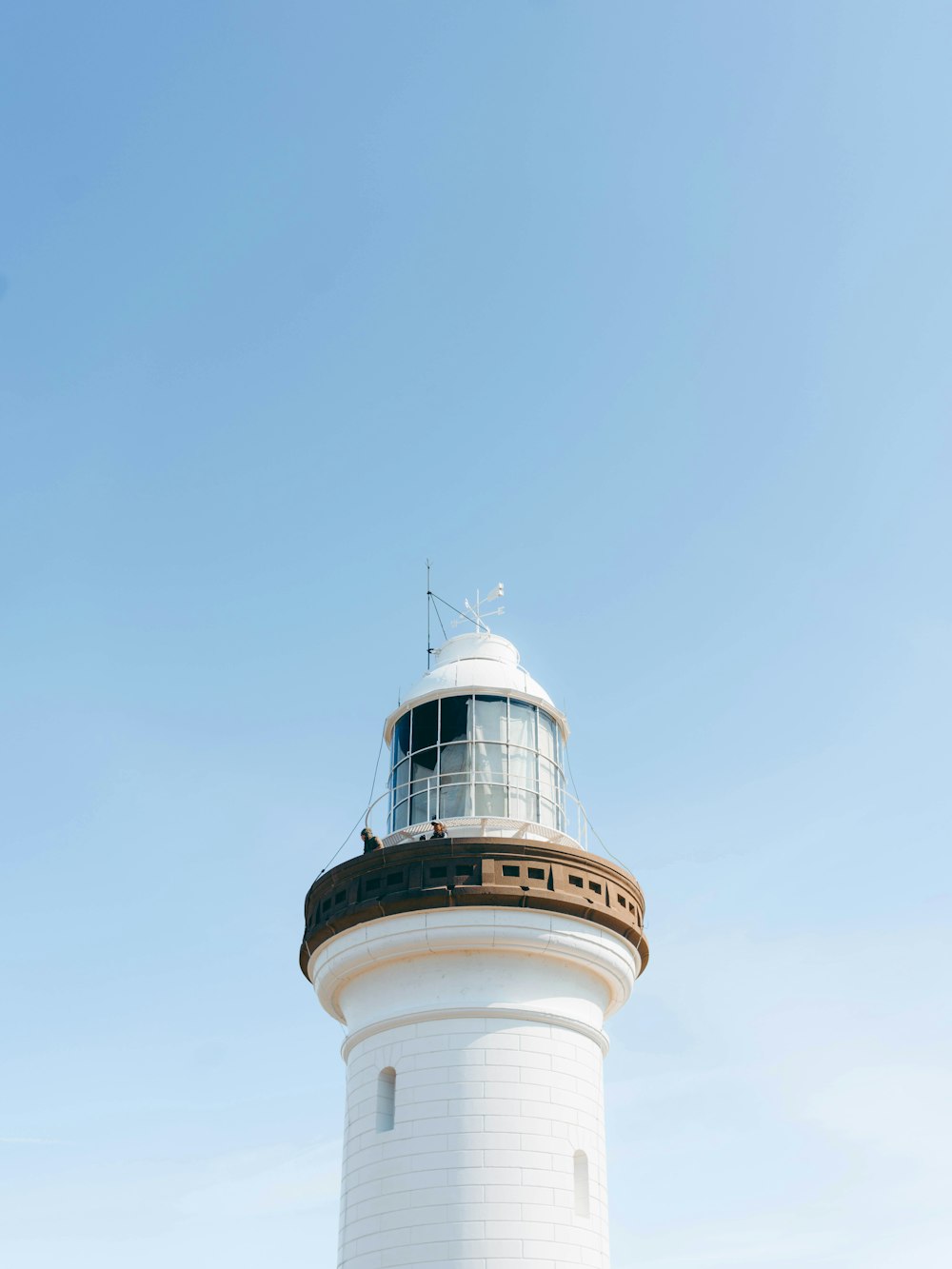 a white tower with a white top