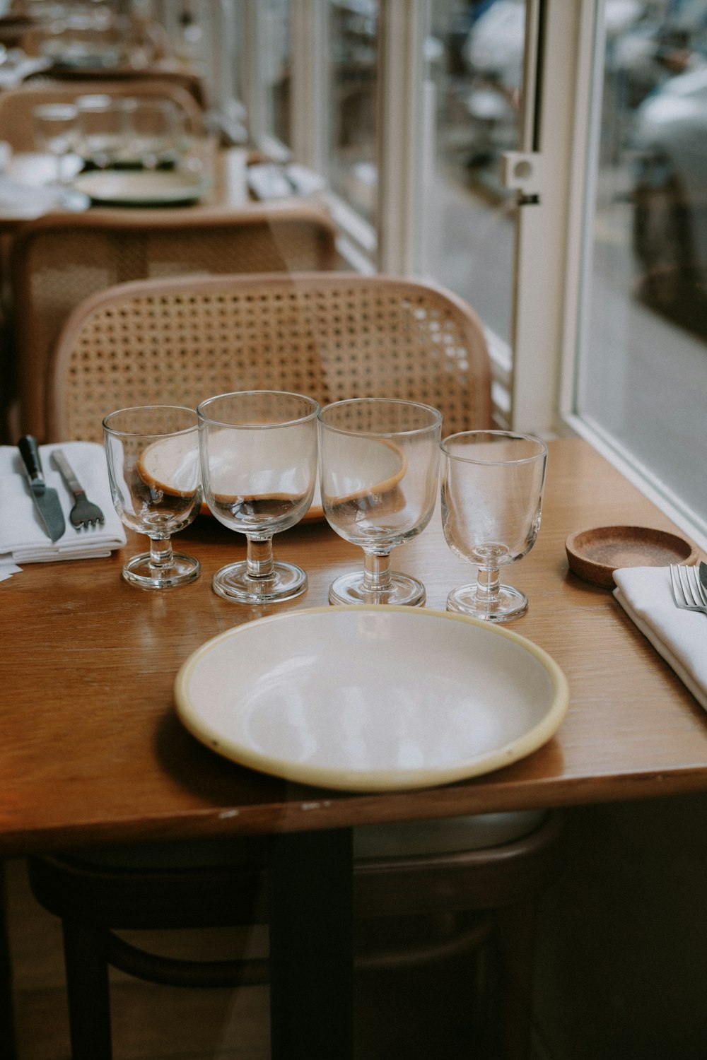 a table with glasses and plates on it