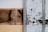 Weathered wooden panels with streaks of white paint and visible scratches, alongside a section with a light brown hue.
