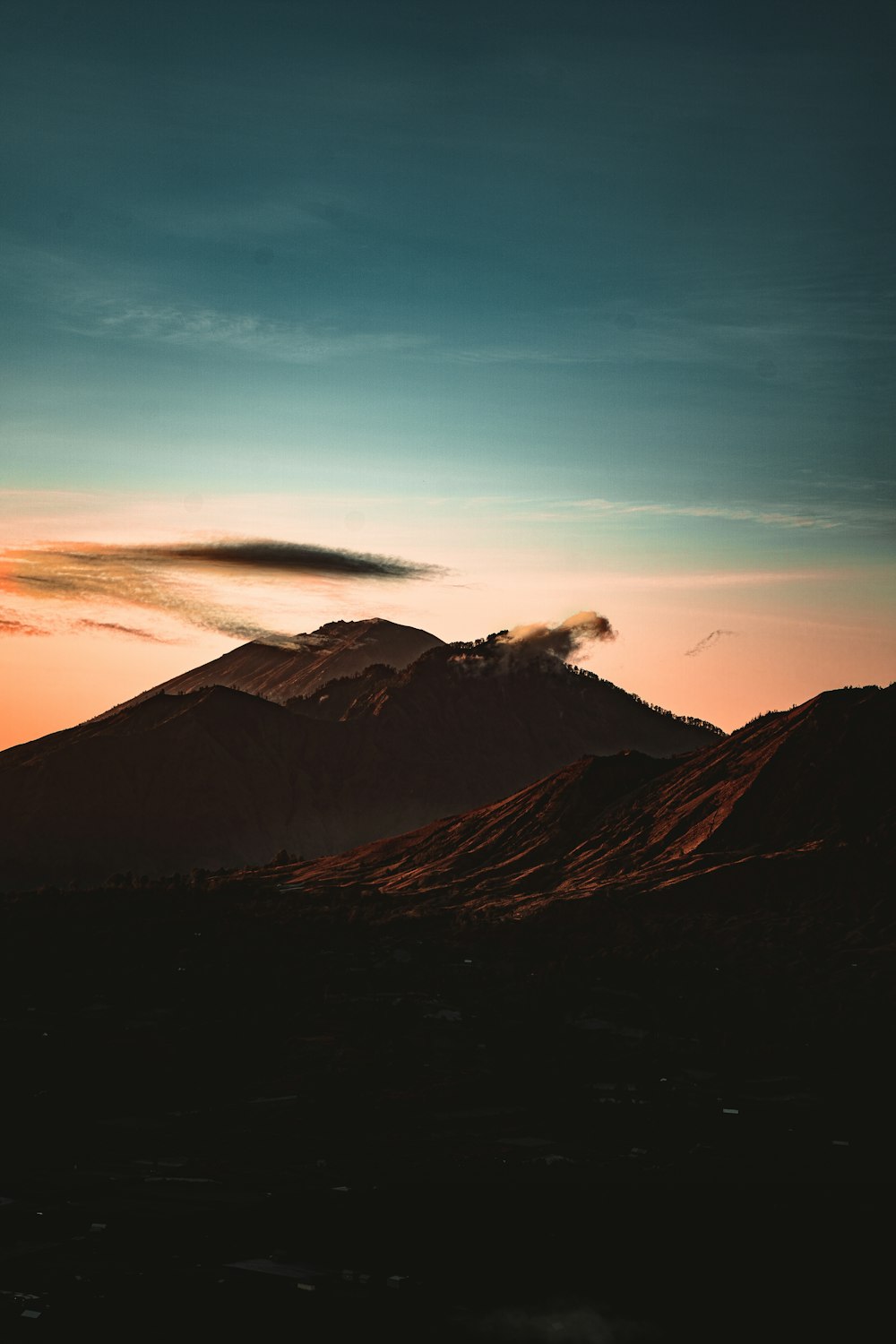 a mountain with a blue sky