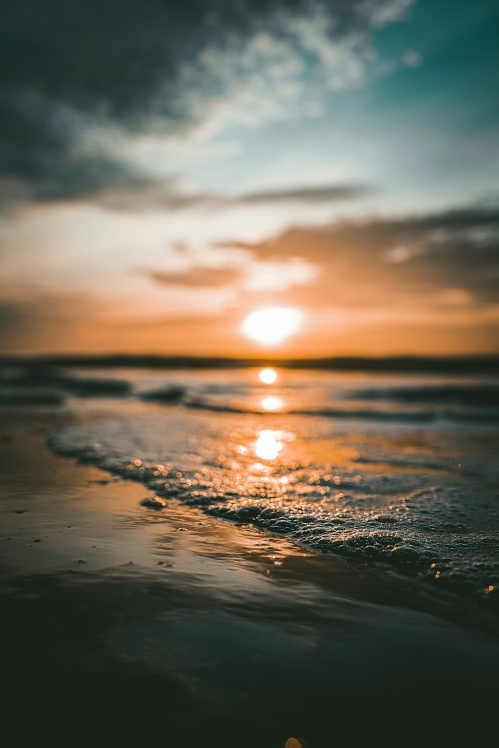 a sunset over a beach