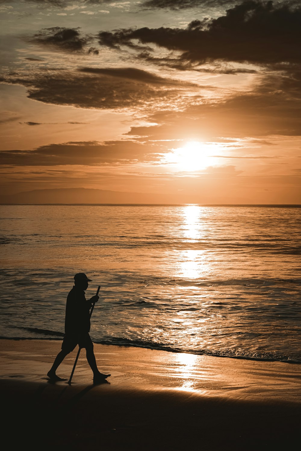 a man walking on a beach