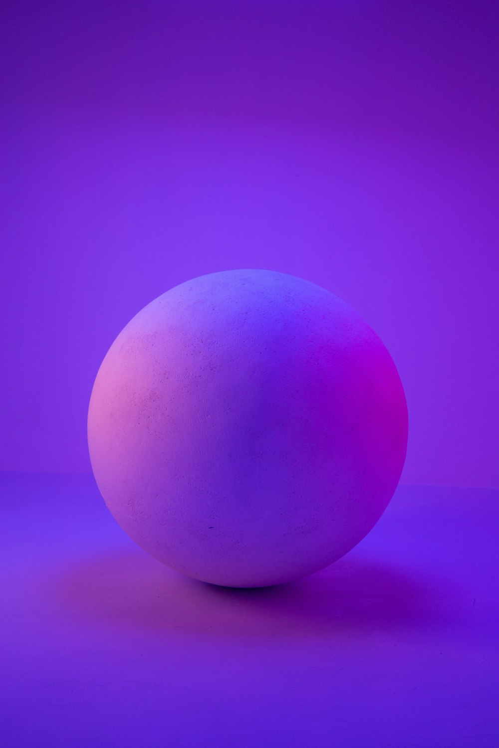 a large egg on a purple surface