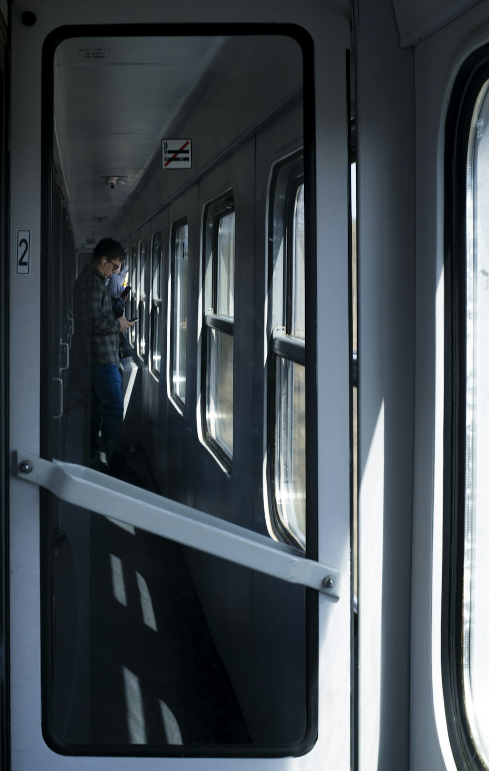 a person standing in a train