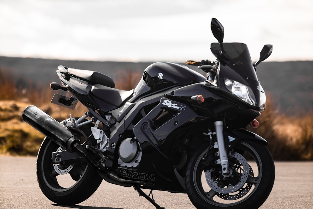 a black motorcycle parked on a road