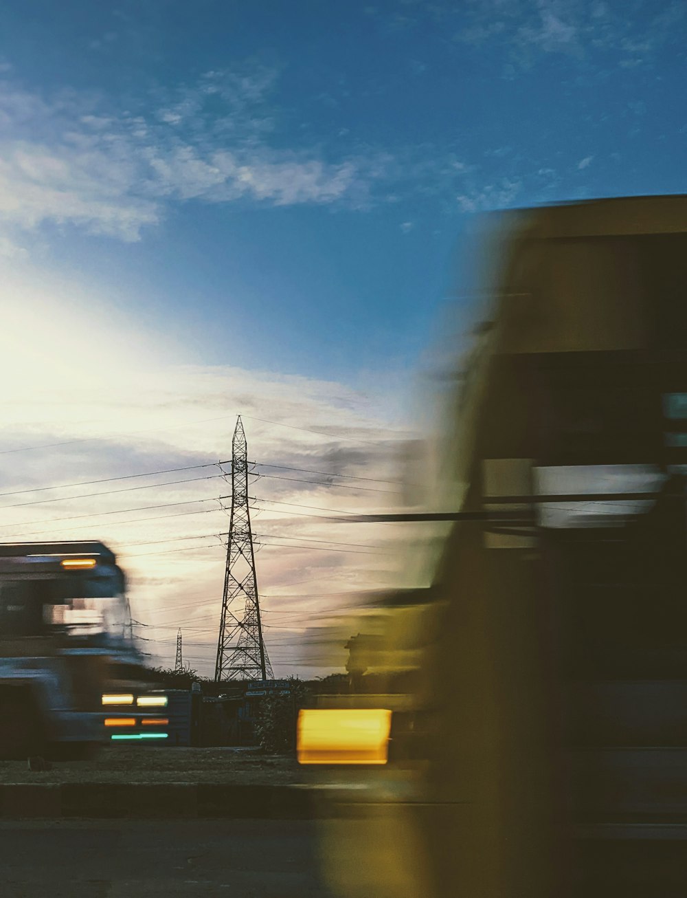 a view of a tower and a power line from a car