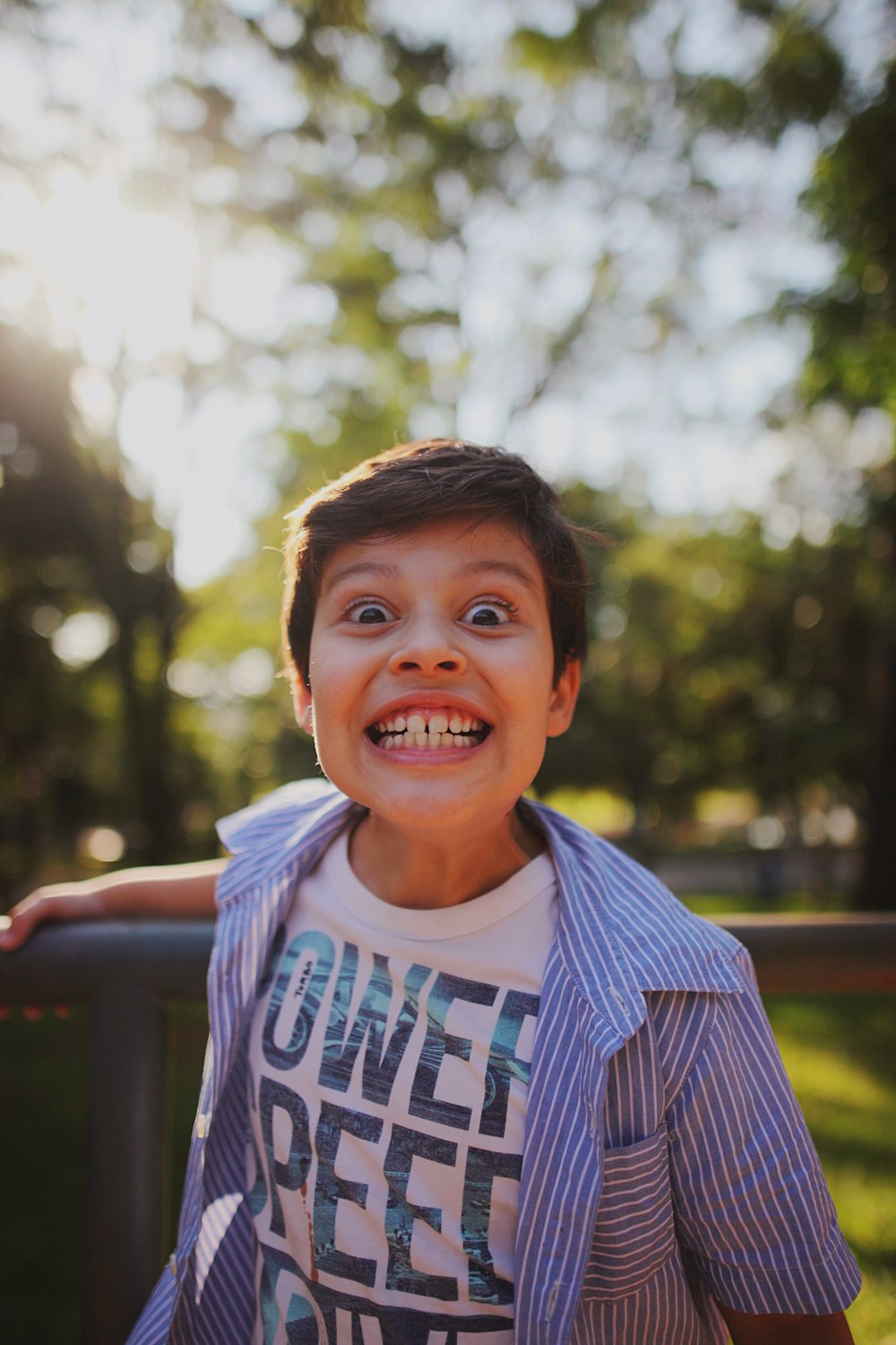 a boy smiling for the camera