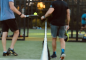 a person hitting a ball with a racket