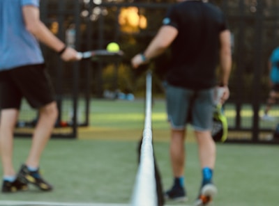 a person hitting a ball with a racket