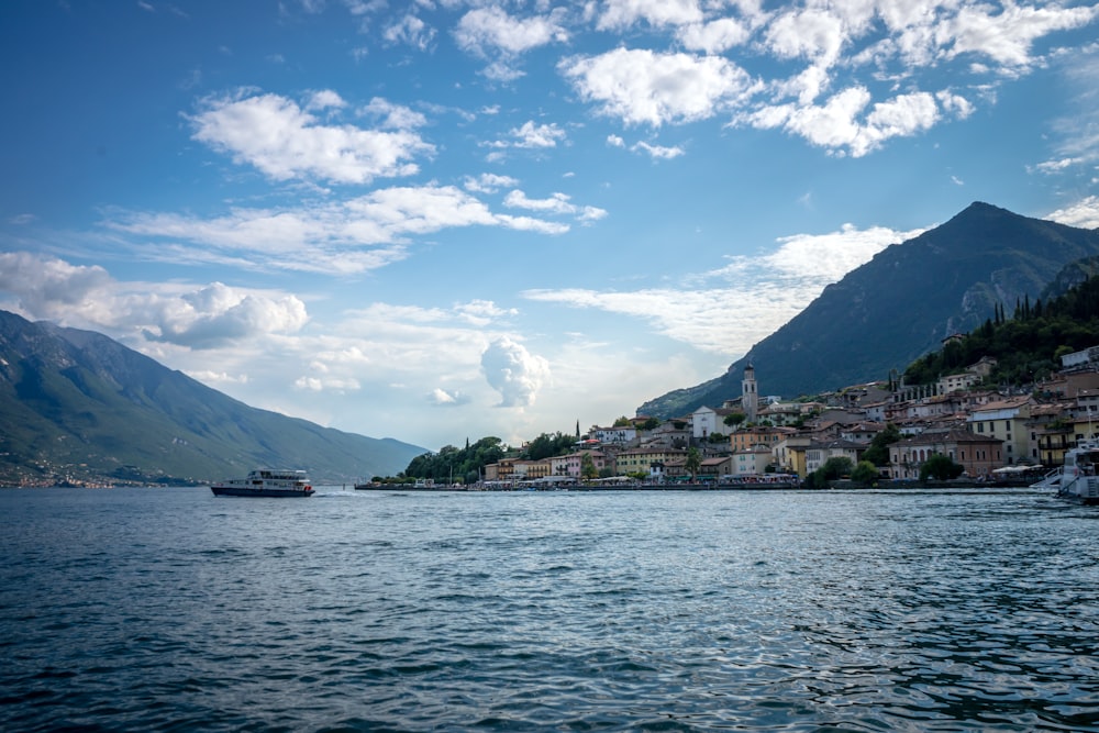 a body of water with a boat in it and buildings in the back