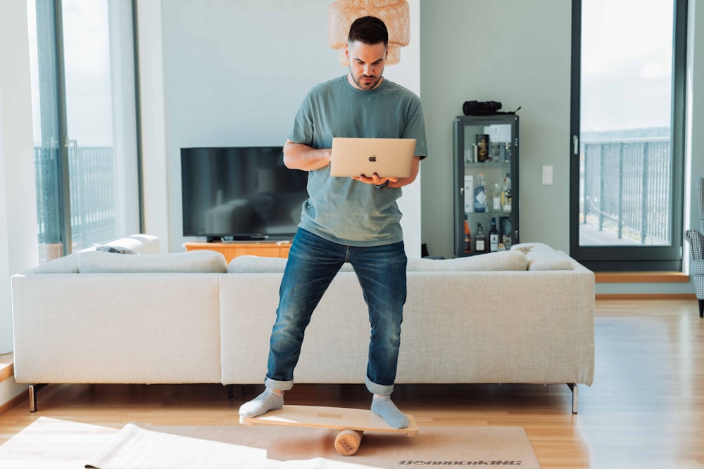 a person holding a laptop