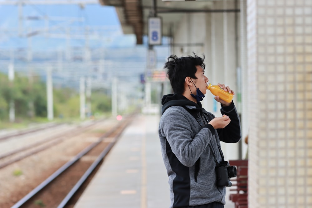 a person drinking from a cup