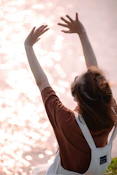 a woman raising her hand