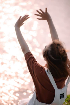 a woman raising her hand
