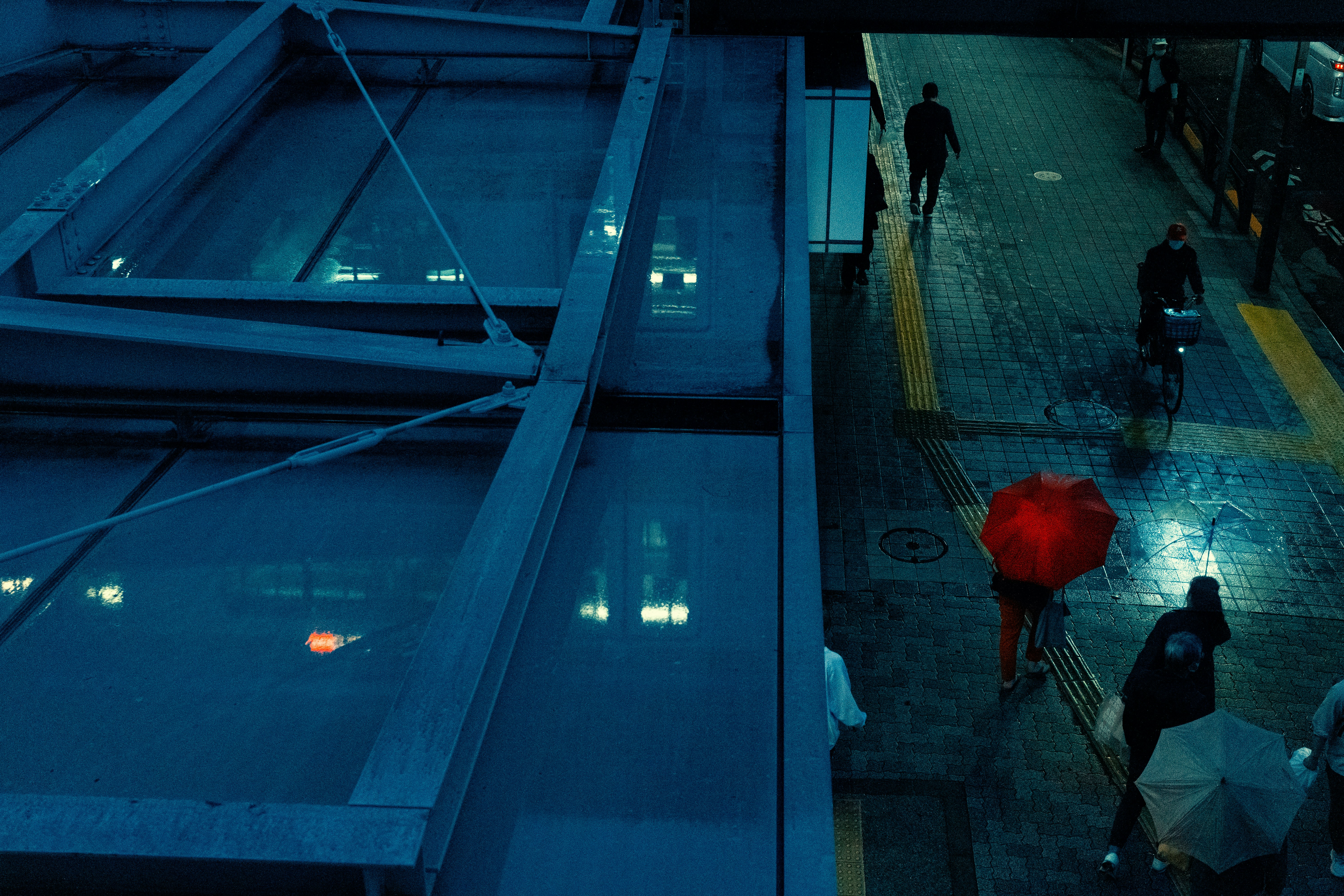 people walking on a sidewalk