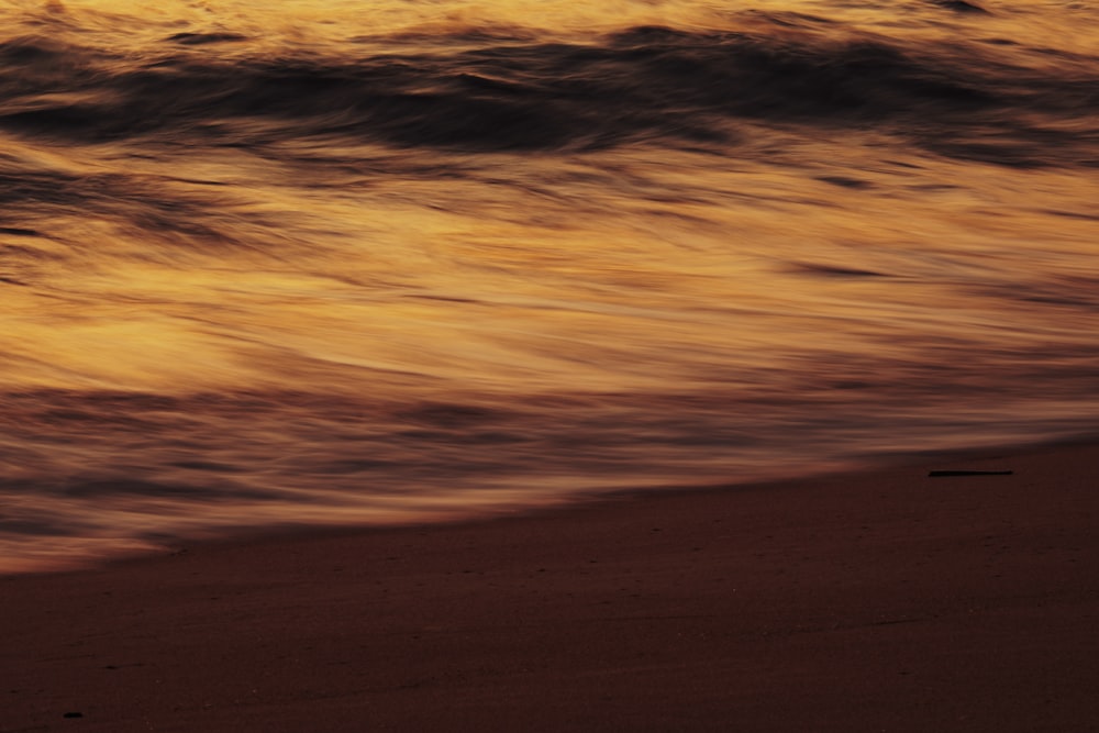 a sunset over a sandy area