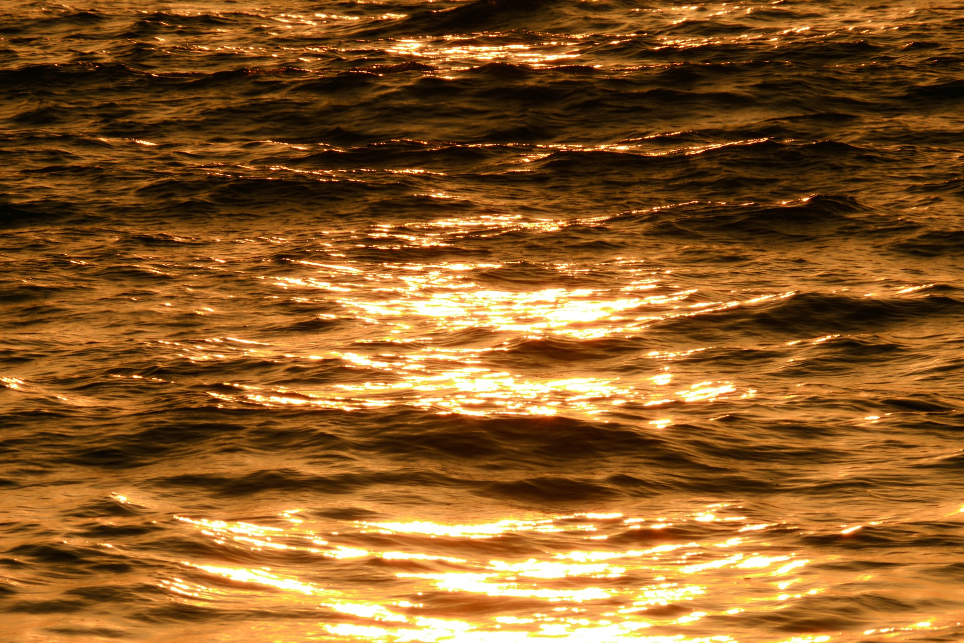 a body of water with a sunset