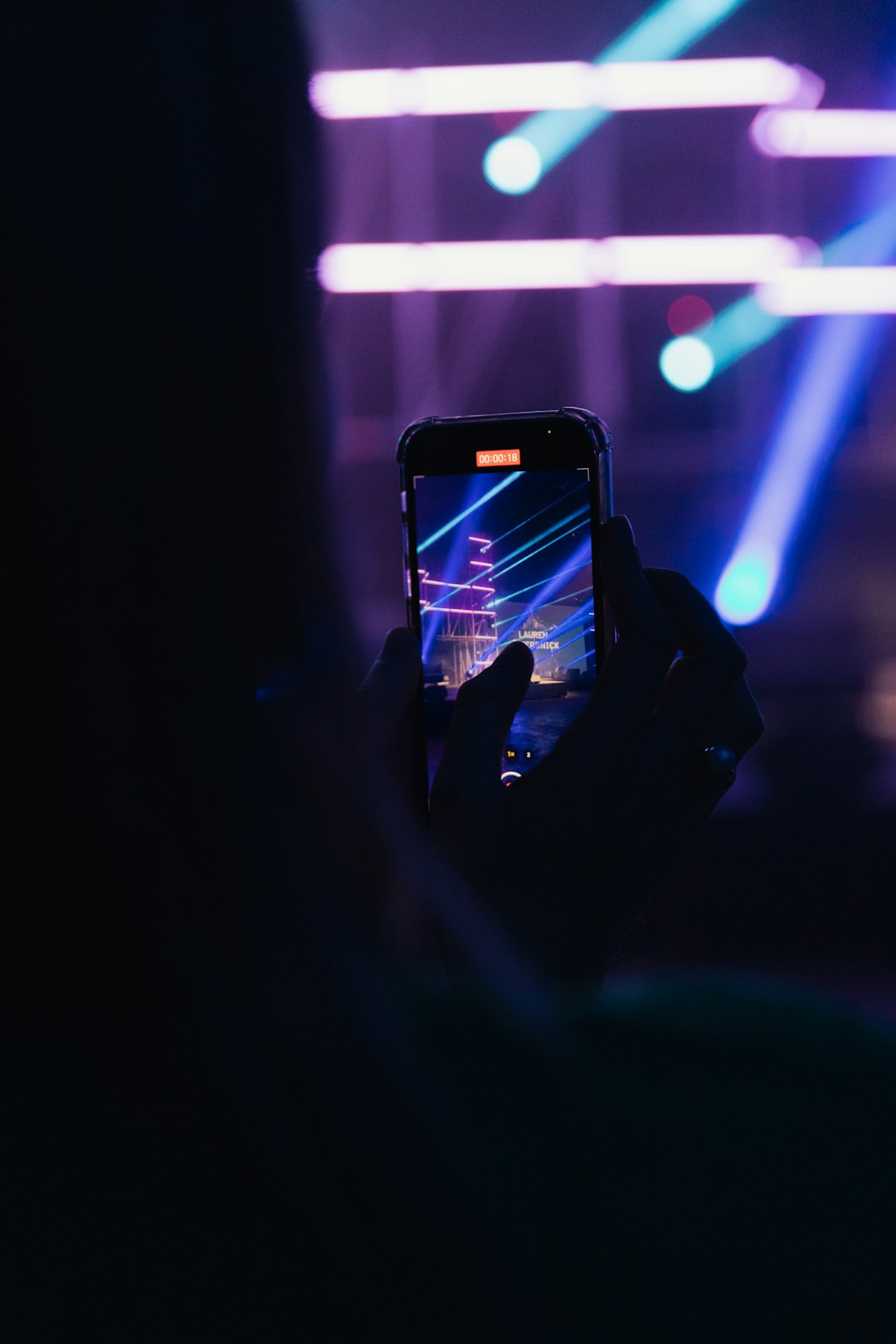 person checking Instagram on smartphone at night