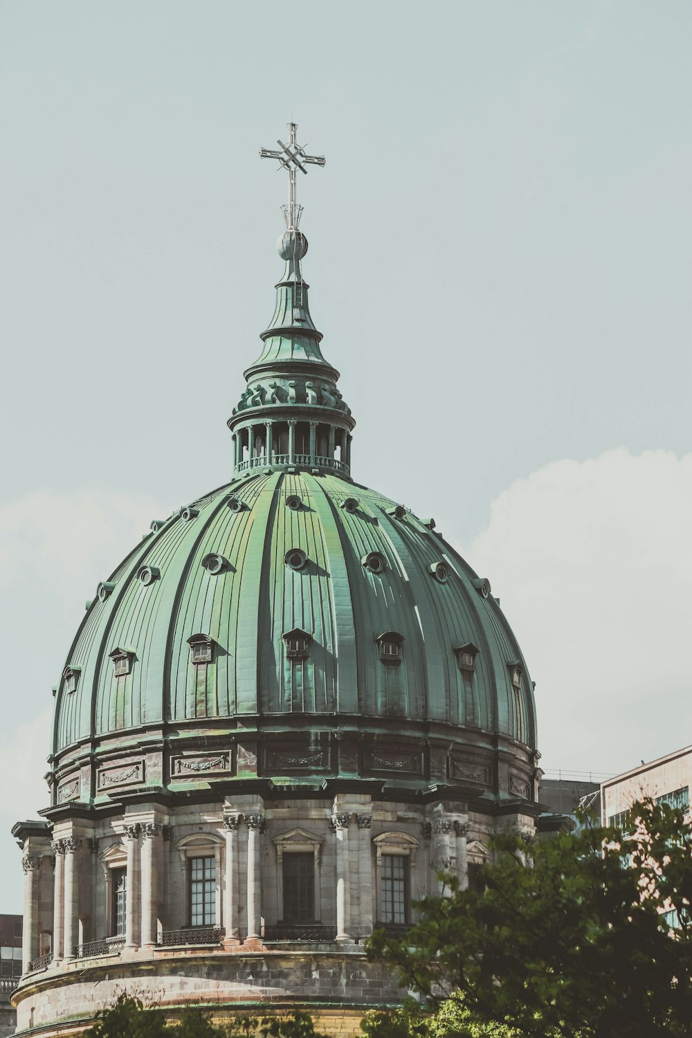 a large building with a green dome