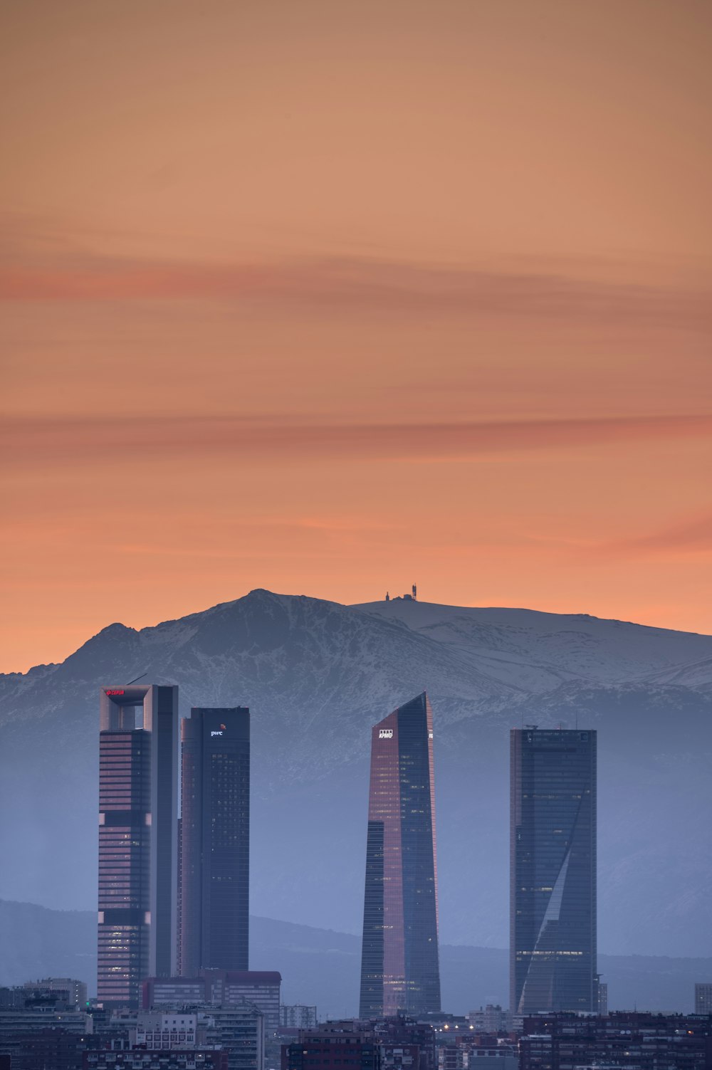 a city with a mountain in the background