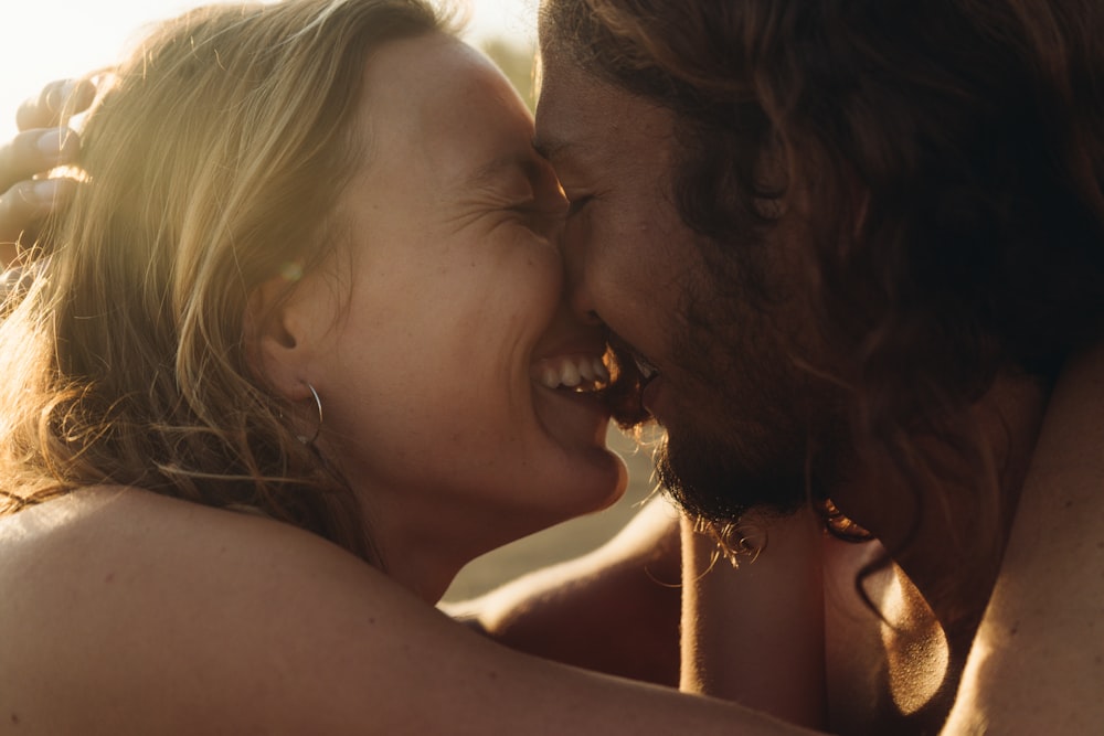 a woman kissing a child