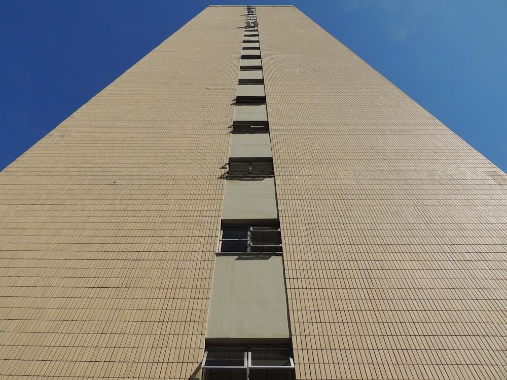 a tall building with a blue sky