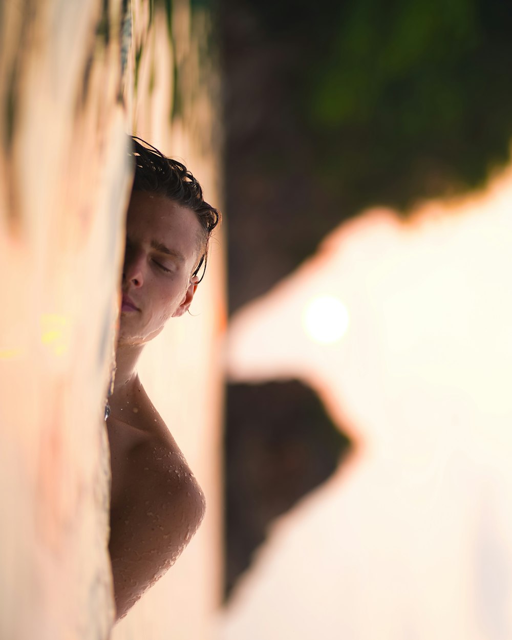 a person looking through a hole in a wall