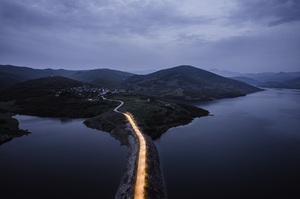 a body of water with a light reflecting off of it