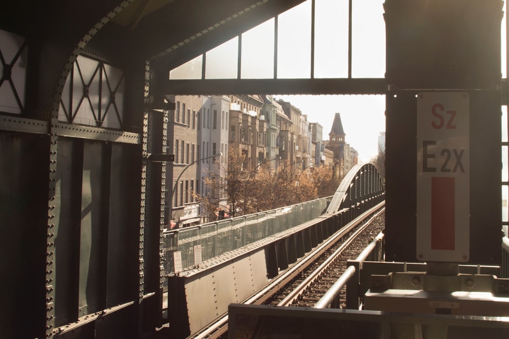 a train track with buildings in the background