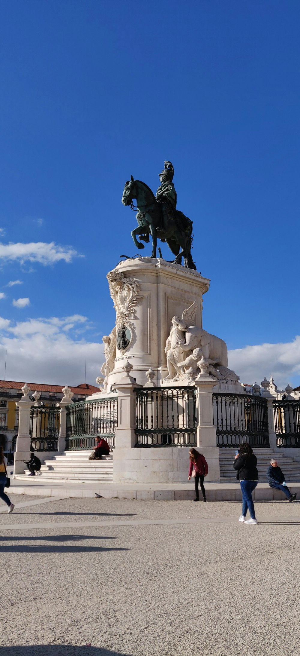 a statue of a person riding a horse