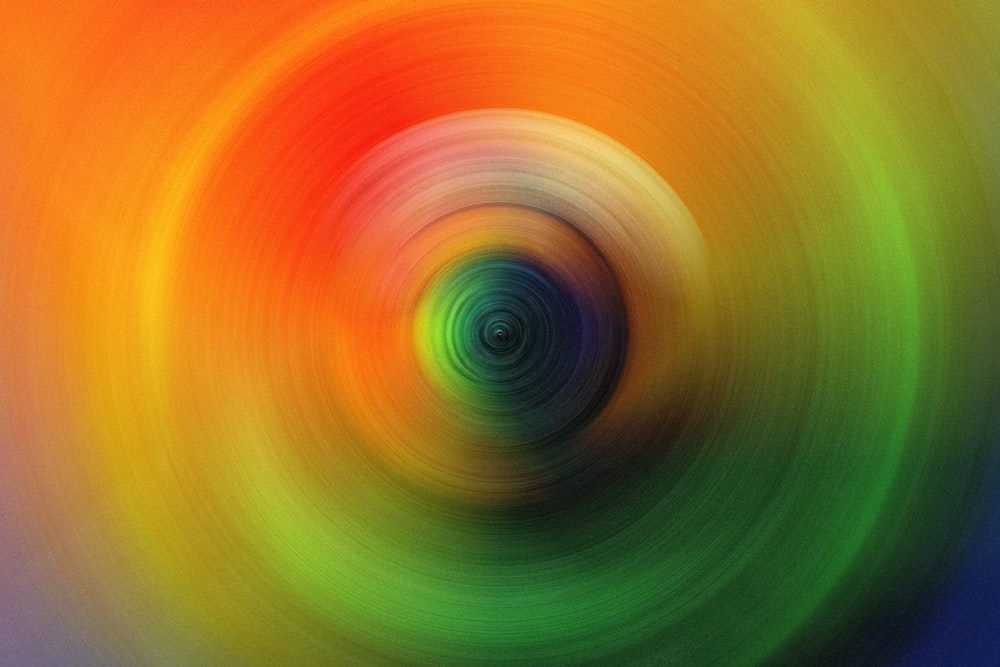 a close up of a green and orange circle