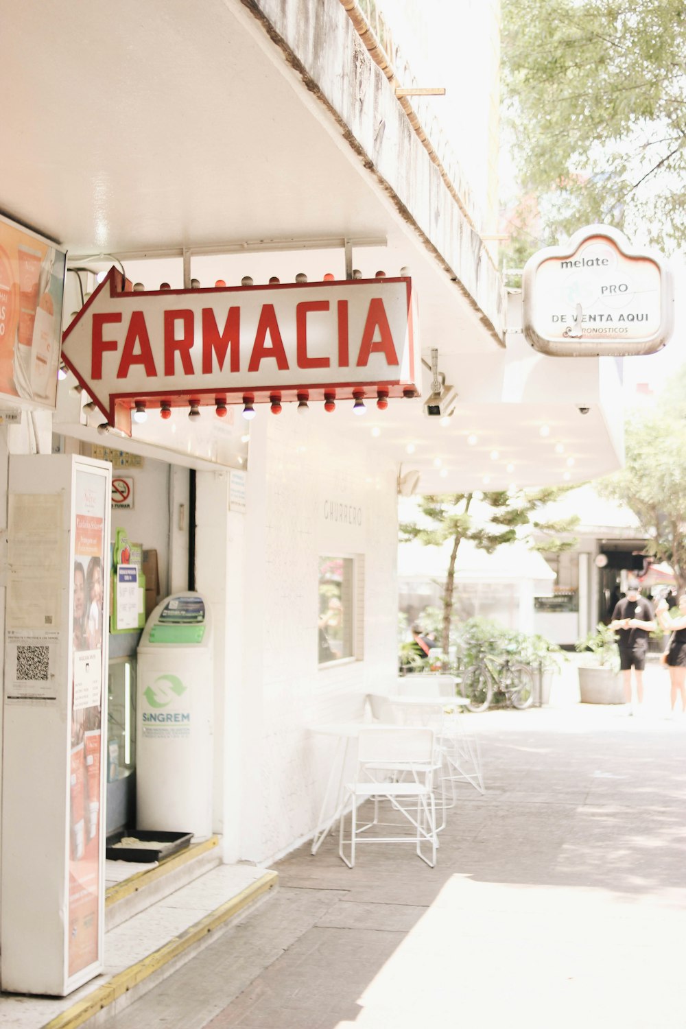 a store front with a white chair