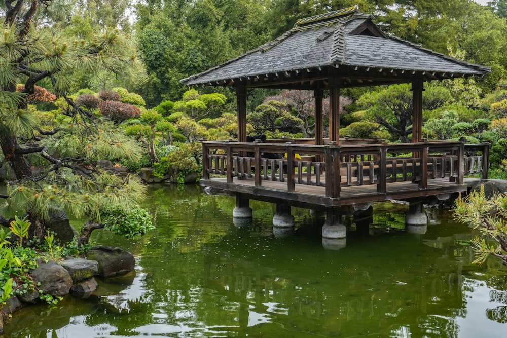 a wooden bridge over a pond