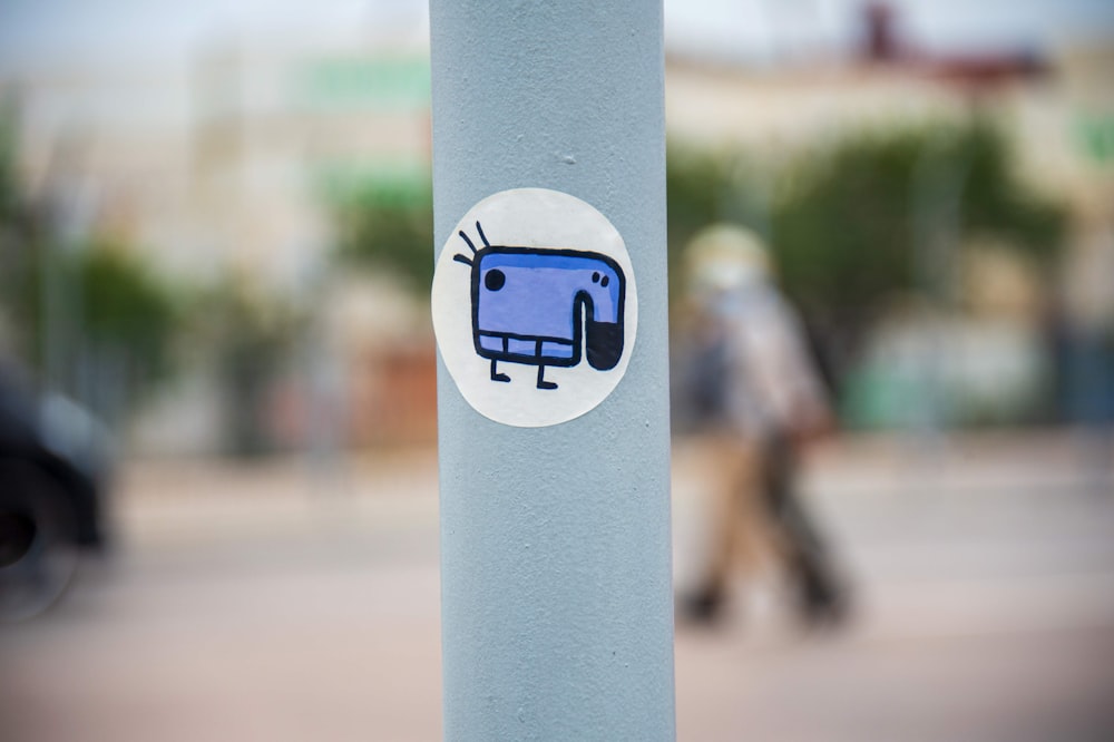 a sticker on a pole