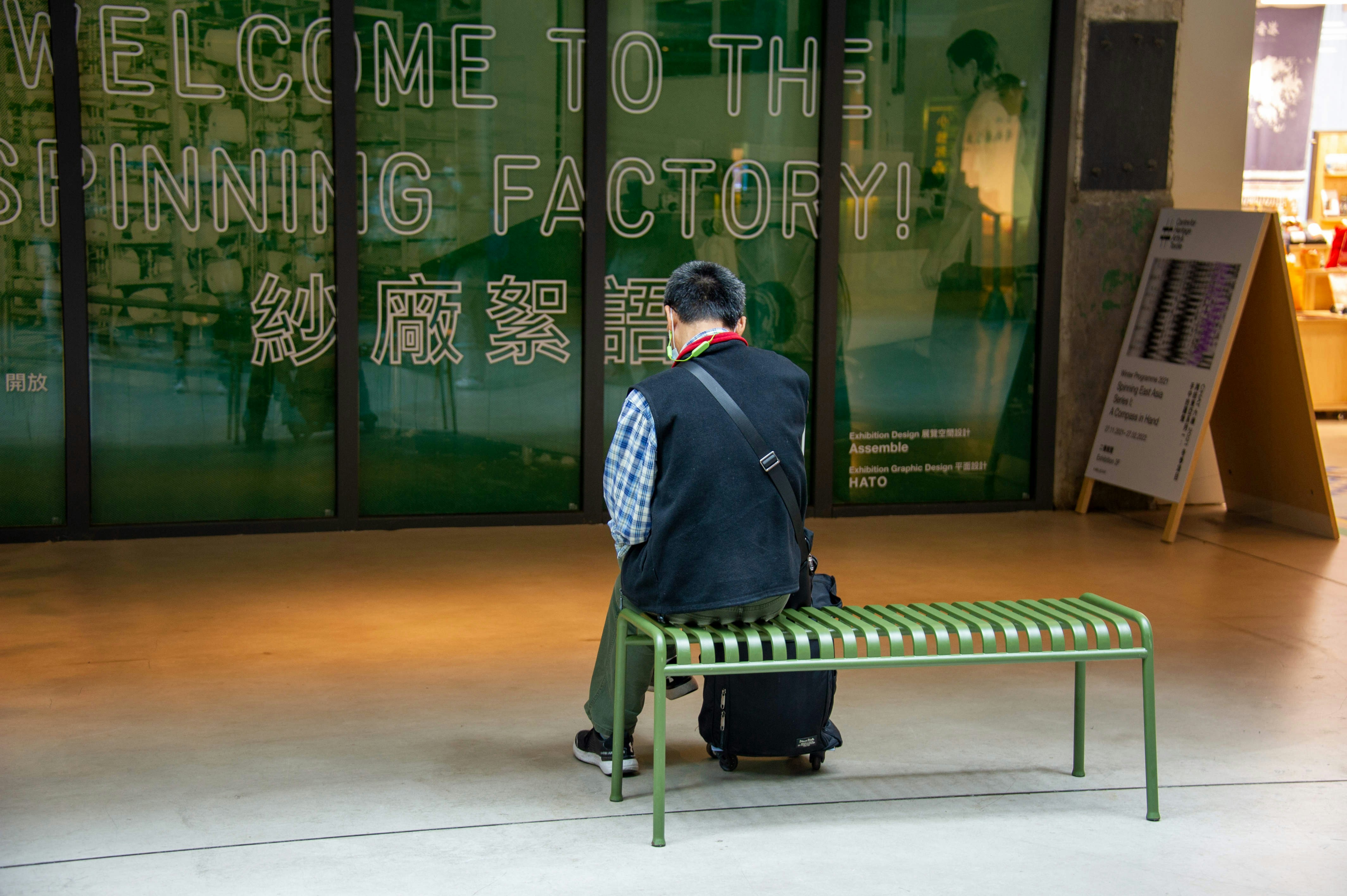 a person sitting on a bench