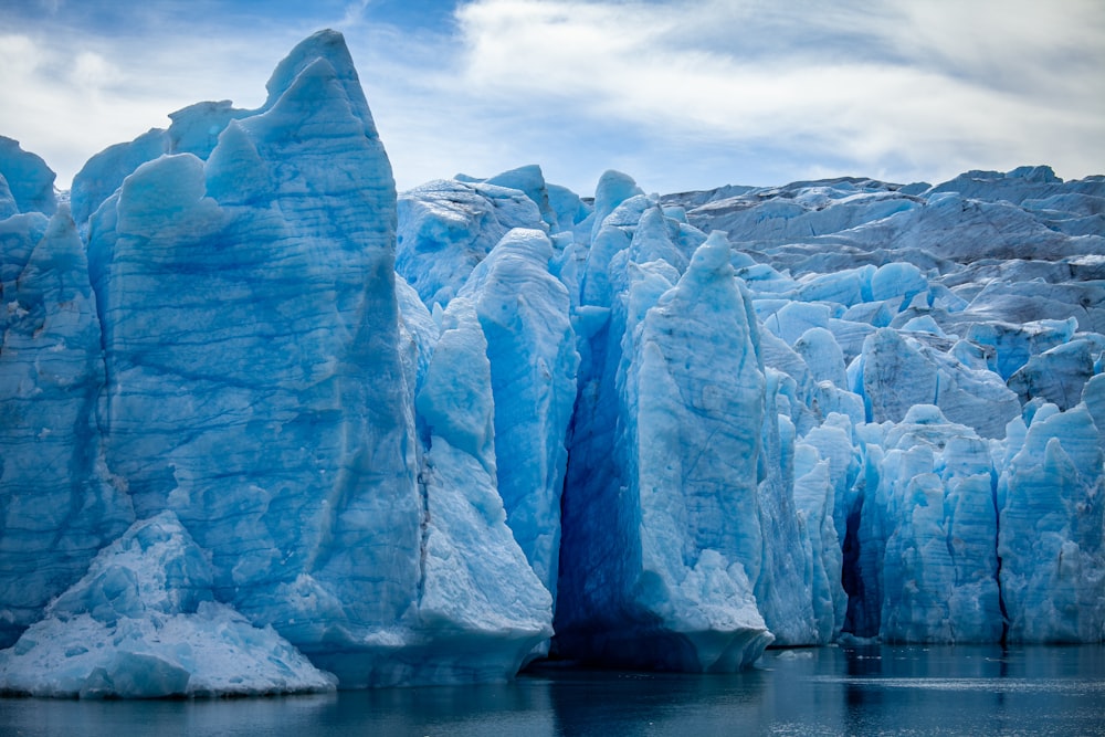 a group of icebergs in the water