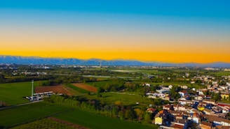 A vibrant investment property scene including lands, hotels, and farms with interactive 3D effects.