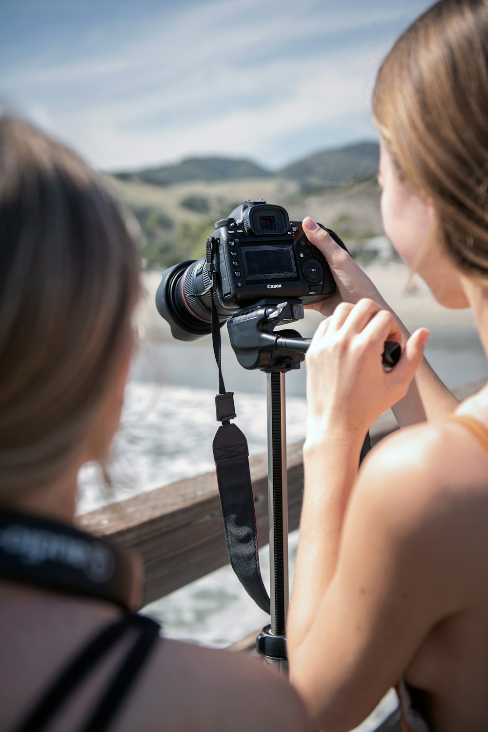 a woman taking a picture of a woman with a camera