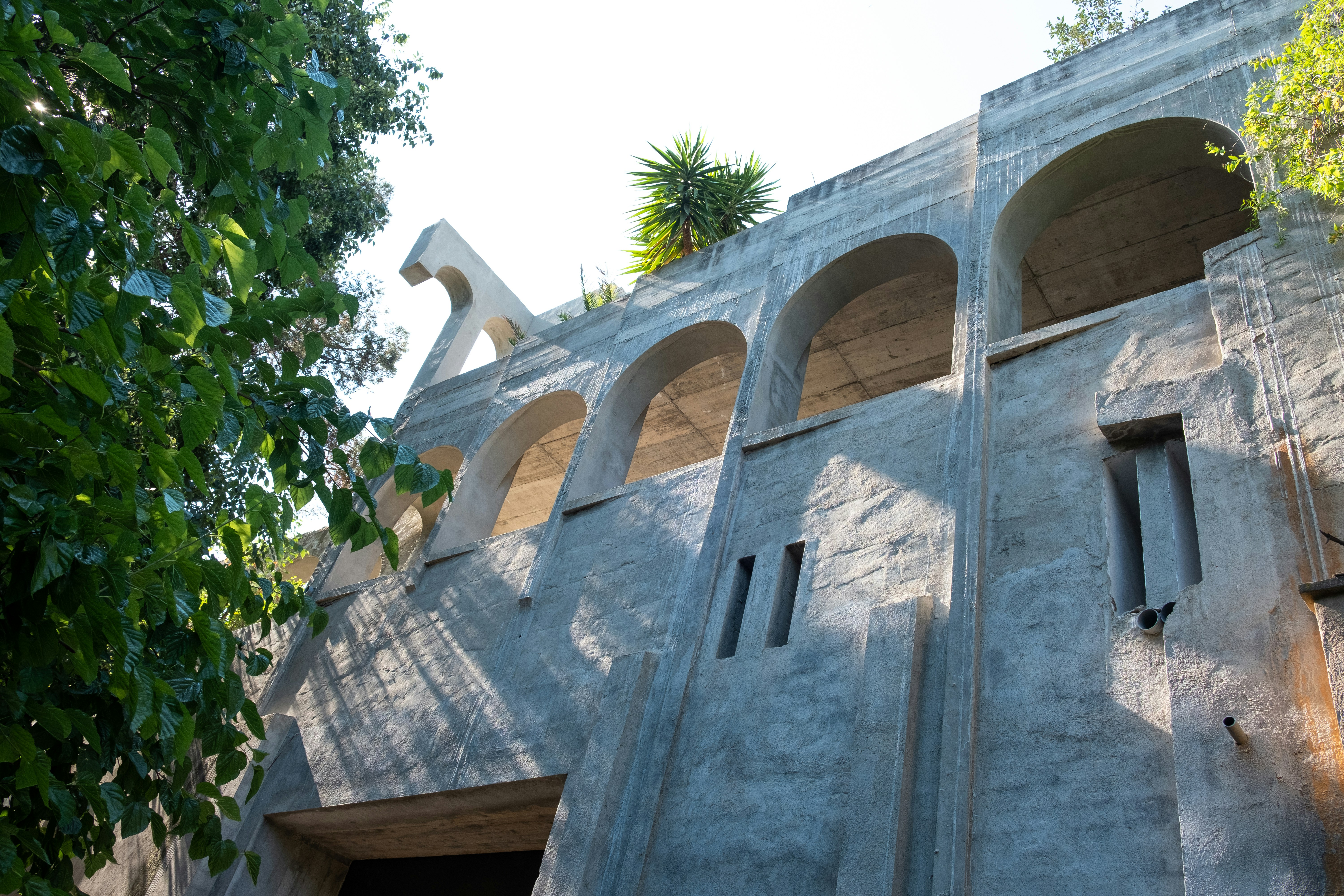 a stone building with a tree