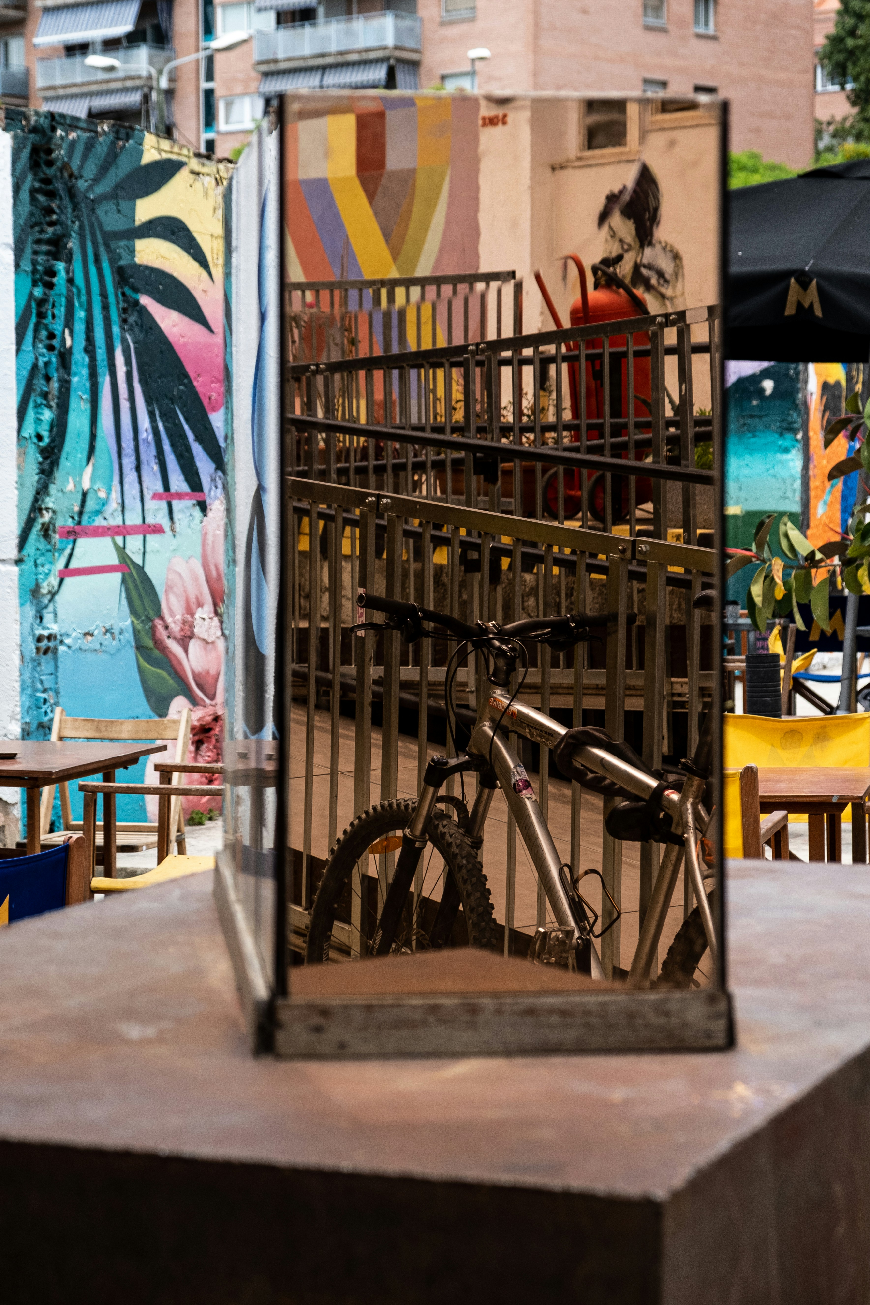 a bike is parked in front of a gate