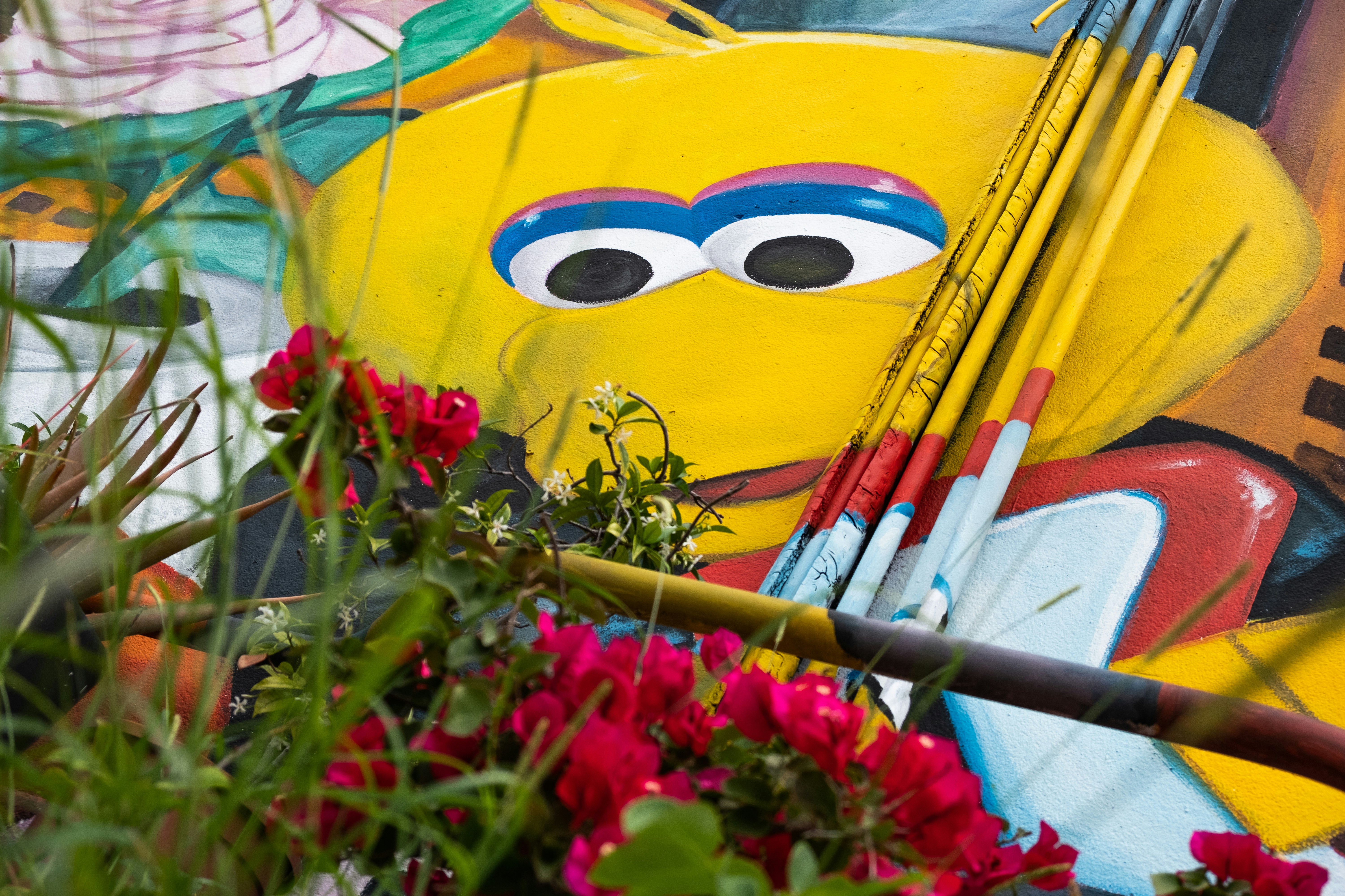 a colorful umbrella with a face