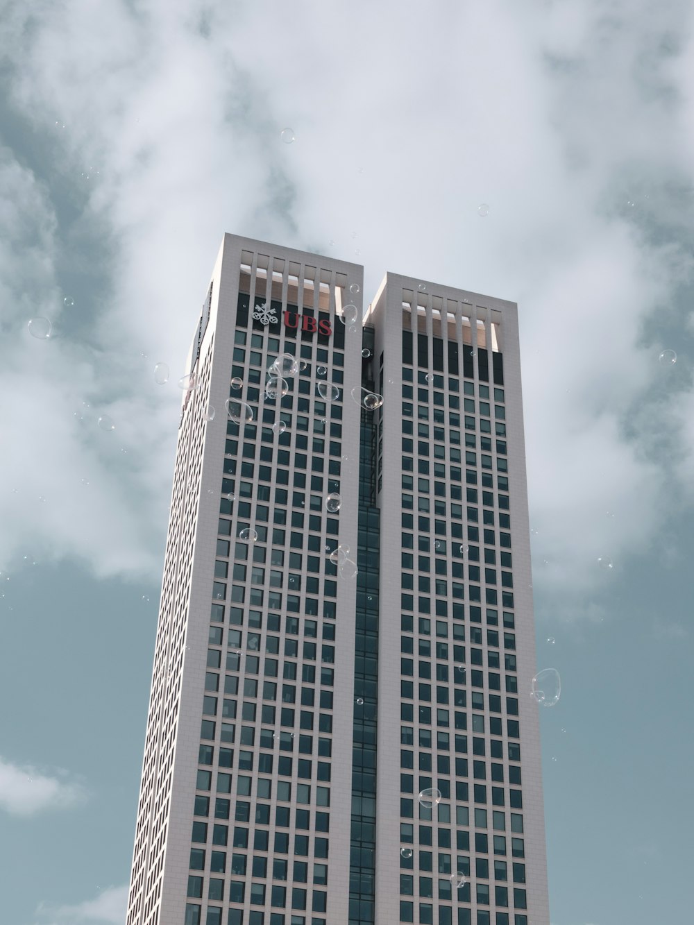 a tall building with a cloudy sky