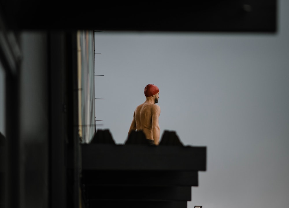 a man sitting on a roof