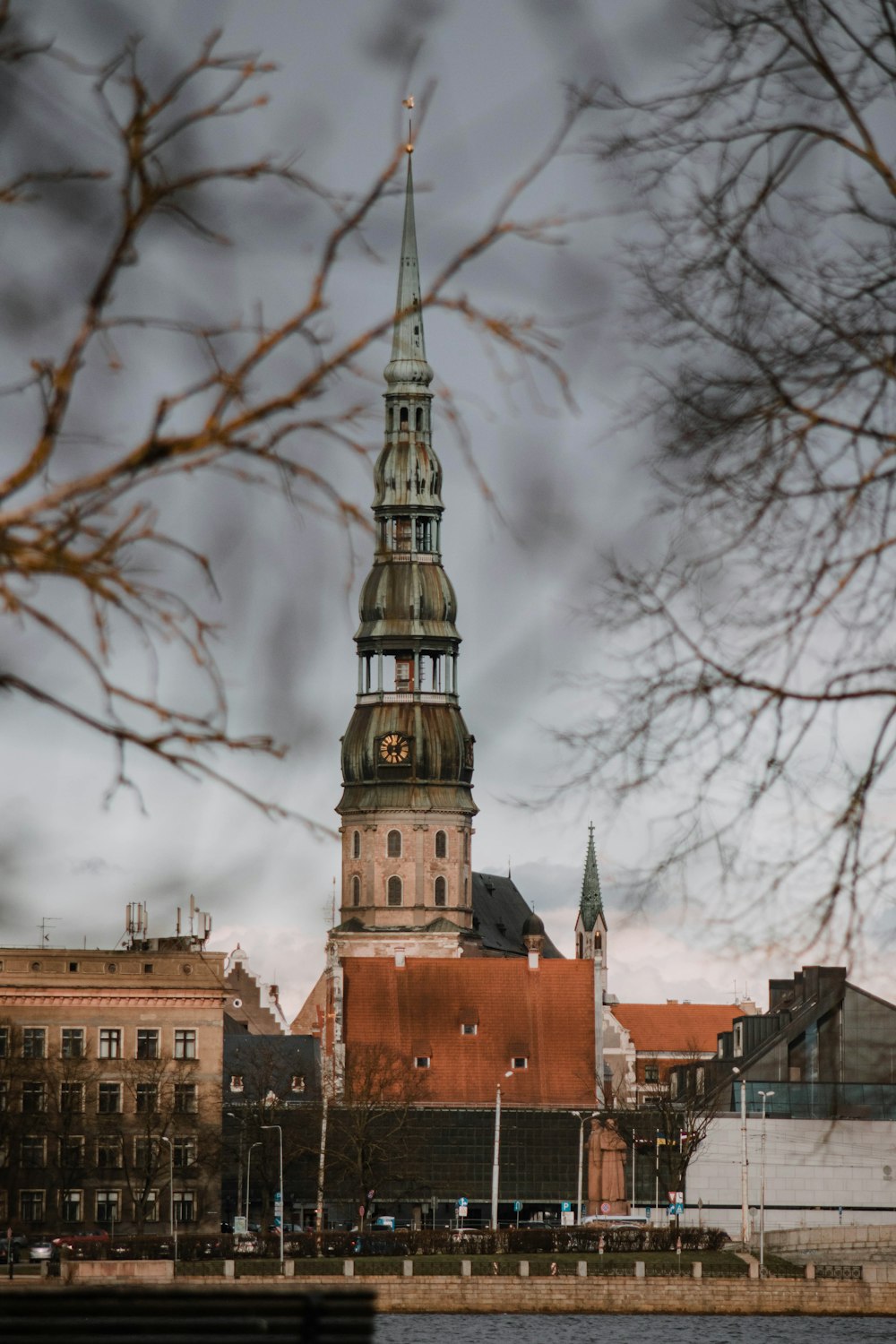 a large building towers over a city