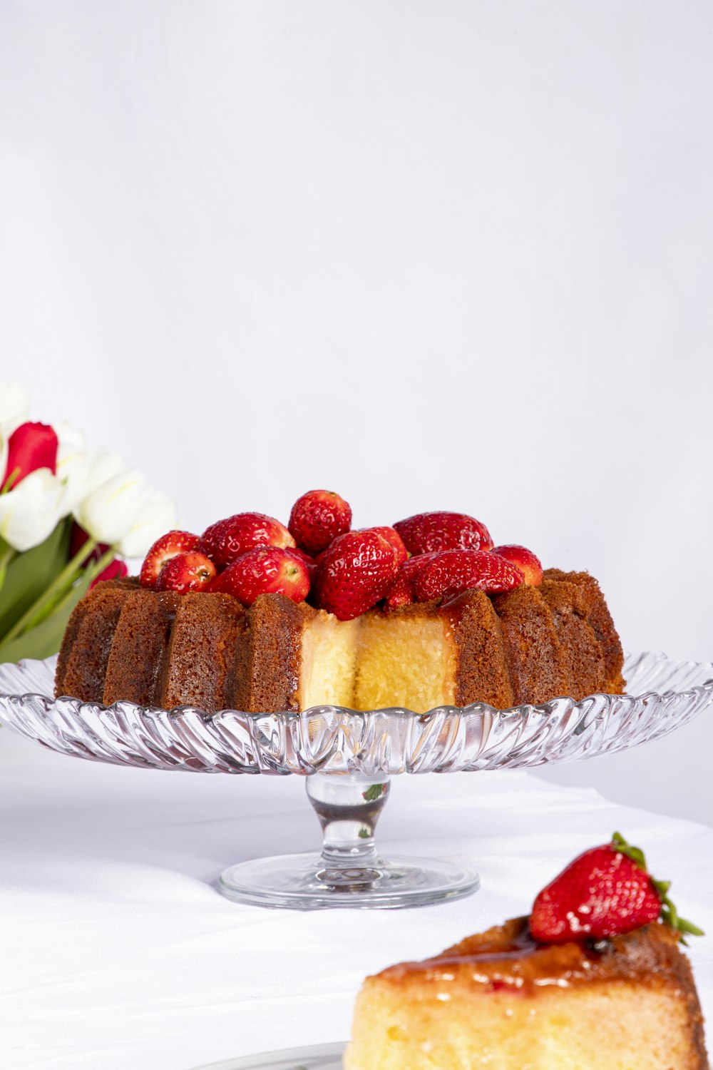 a glass bowl of desserts