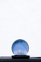 a blue bowl with a white background