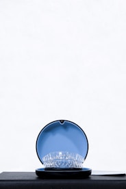 a blue bowl with a white background